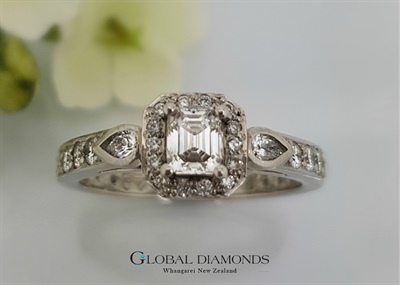 Platinum and Emerald Cut Diamond Cluster Ring