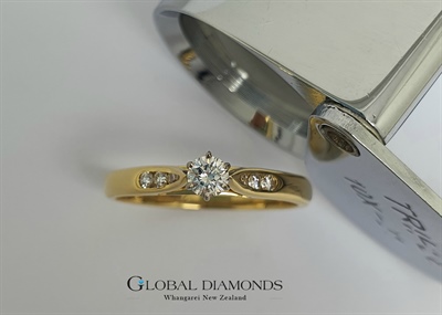 18ct Yellow and White Gold Claw Set Diamond Solitaire Ring with Channel Set Shoulders