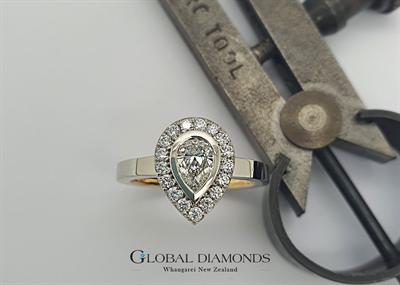 Platinum and 18ct Yellow gold Pear Shaped Diamond Halo Ring